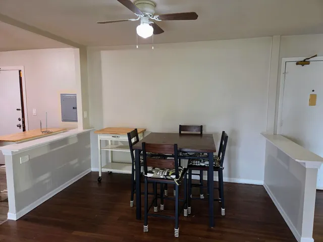 a view of a dining room with furniture and wooden floor