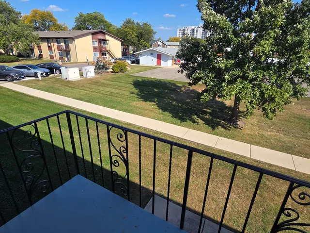 a view of a street from a balcony