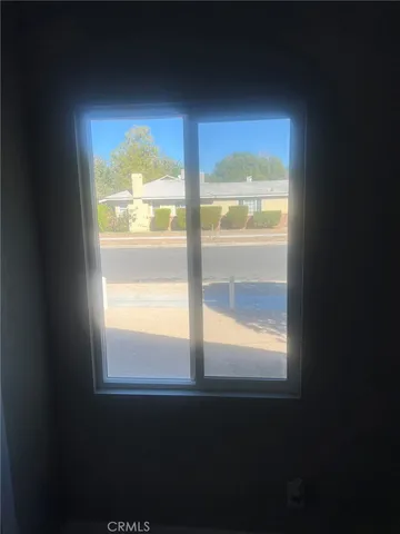 a view of an empty room and window