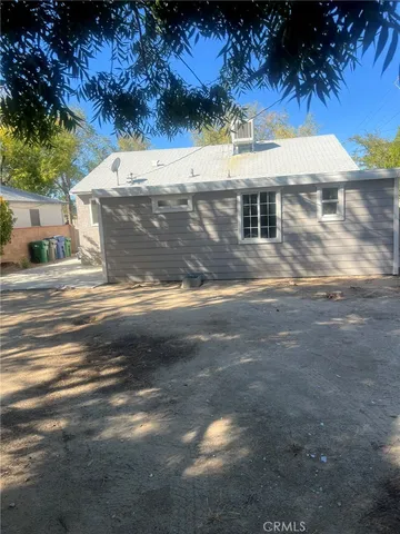 a view of a white house with a ocean view