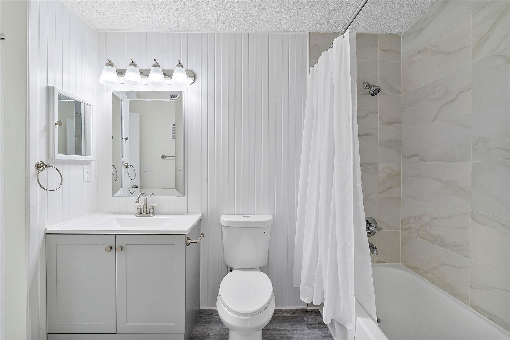 931 Lyons Road, Unit 4204 Coconut Creek, FL 33063 - Photo 6 of 17 a bathroom with a sink toilet and shower