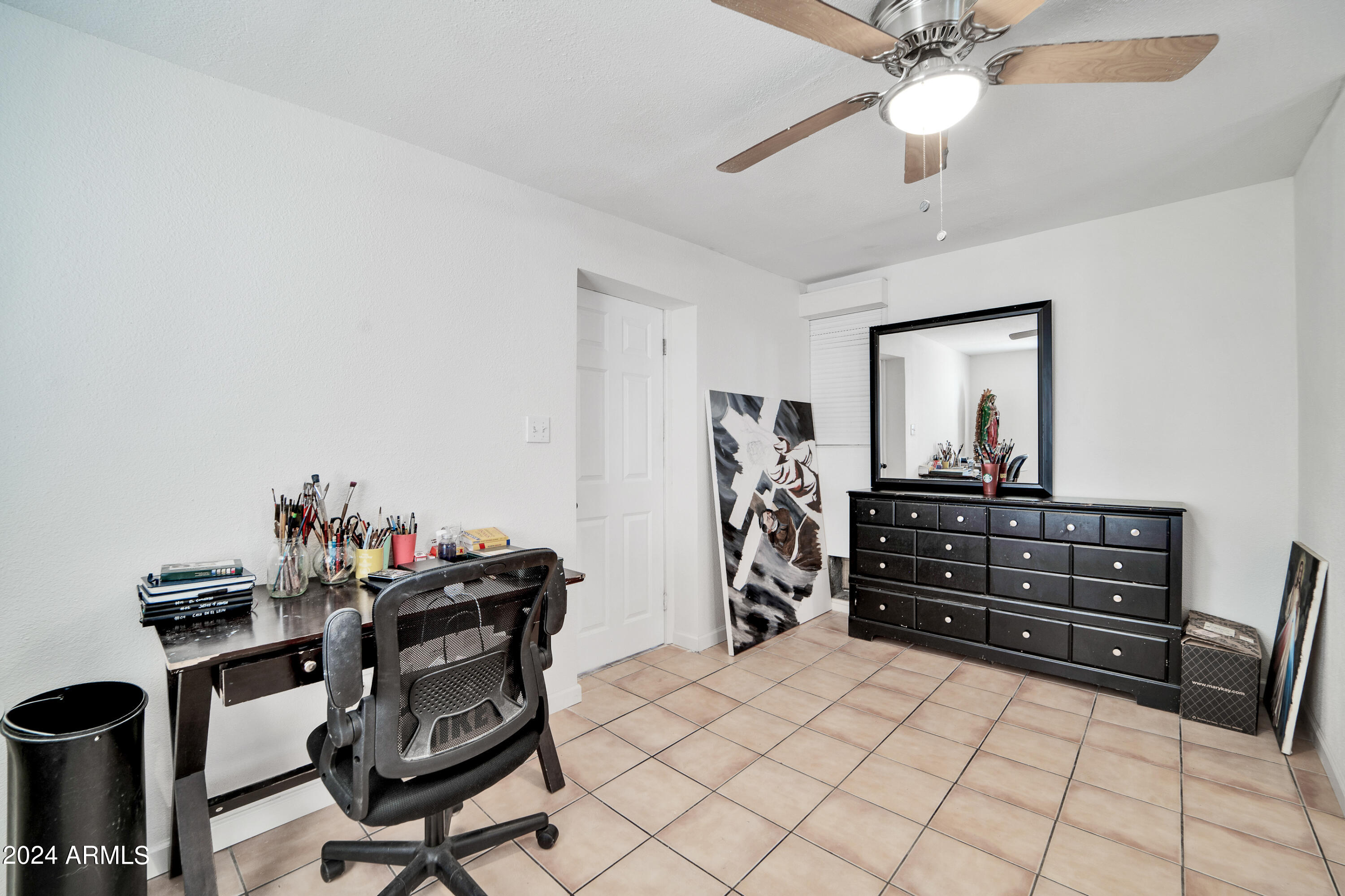 7601 West Osborn Road Phoenix, AZ 85033 - Photo 21 of 37 a room with furniture and wooden floor