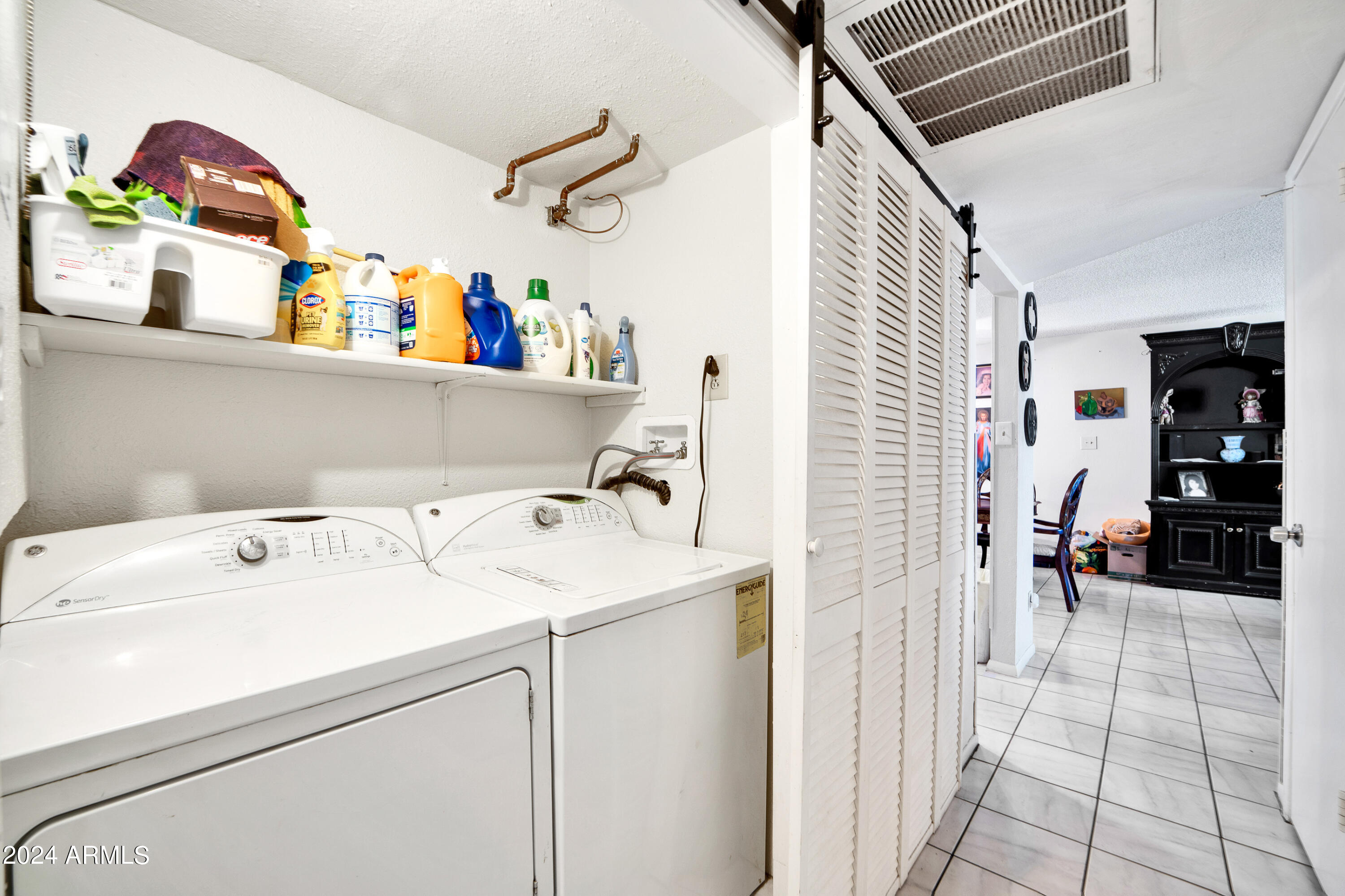 7601 West Osborn Road Phoenix, AZ 85033 - Photo 29 of 37 a utility room with dryer and washer