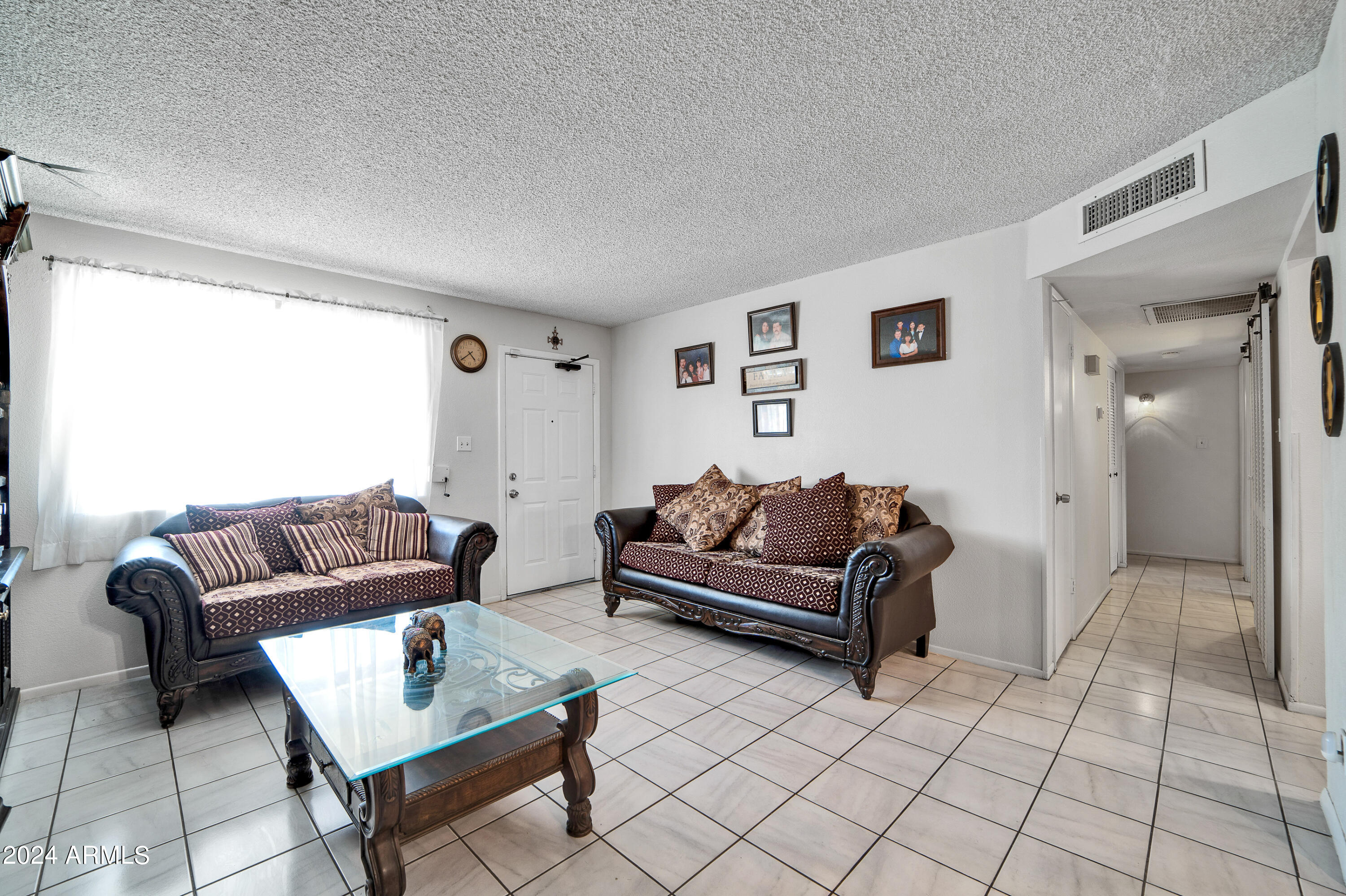 7601 West Osborn Road Phoenix, AZ 85033 - Photo 4 of 37 a living room with furniture and a couch