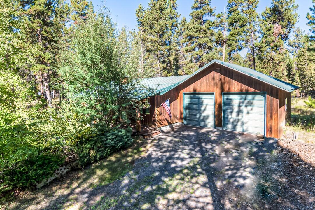 17026 Torrance Road Bend, OR 97707 - Photo 2 of 27 a front view of a house with a yard