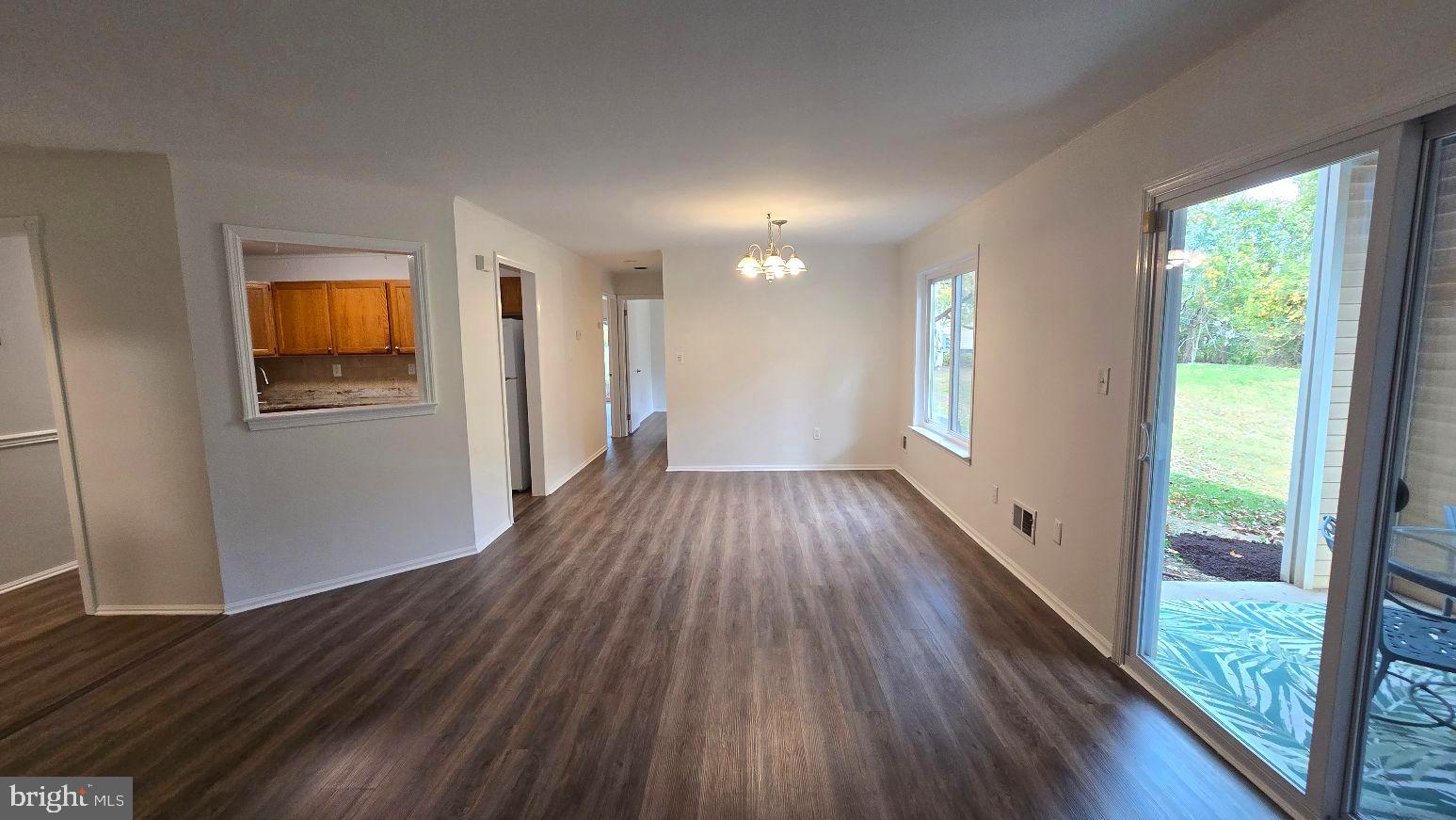 325 Silvia Street Ewing, NJ 08628 - Photo 11 of 21 a view of a room with wooden floor and windows