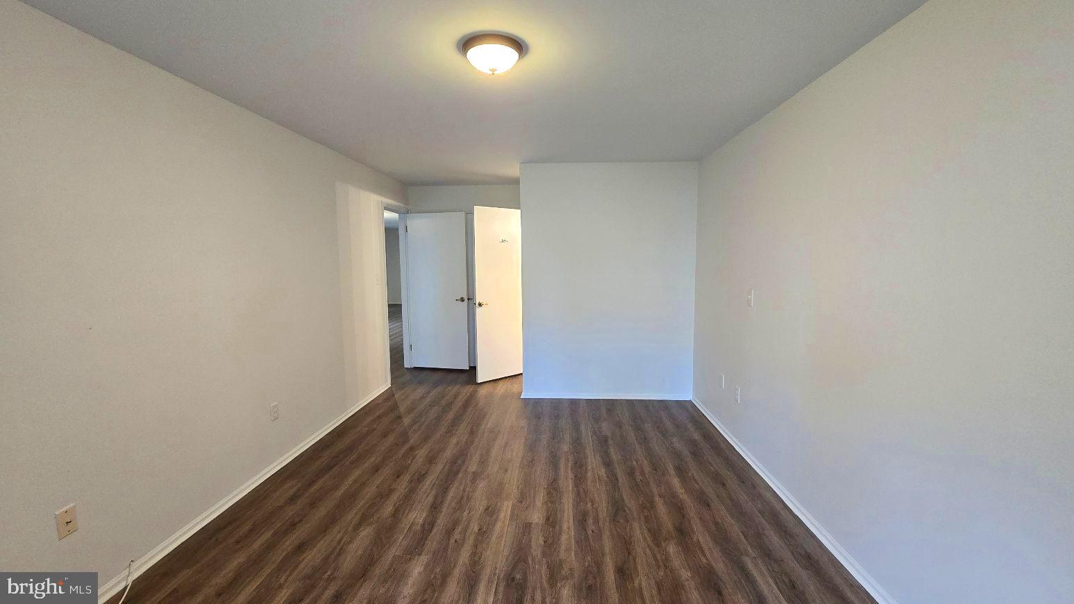 325 Silvia Street Ewing, NJ 08628 - Photo 16 of 21 a view of wooden floor in an empty room