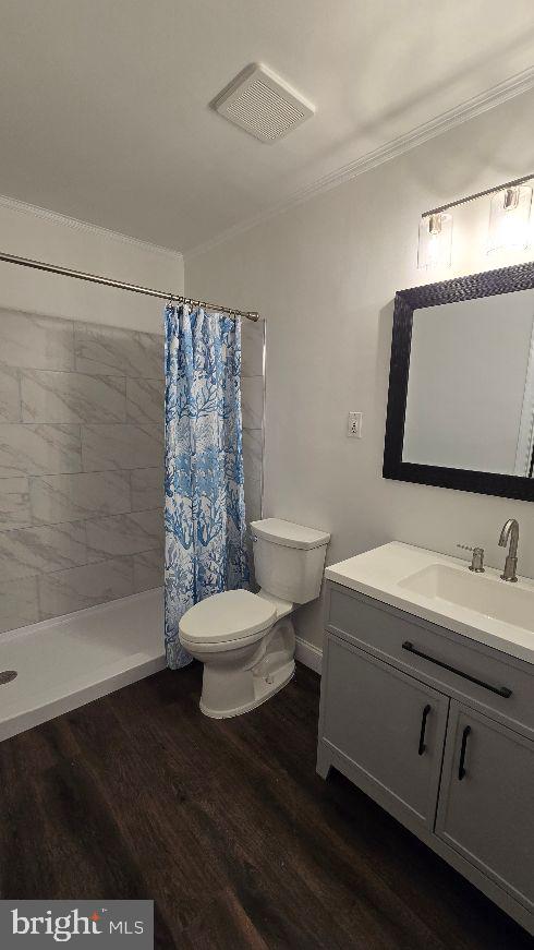 325 Silvia Street Ewing, NJ 08628 - Photo 19 of 21 a bathroom with a sink a toilet and shower
