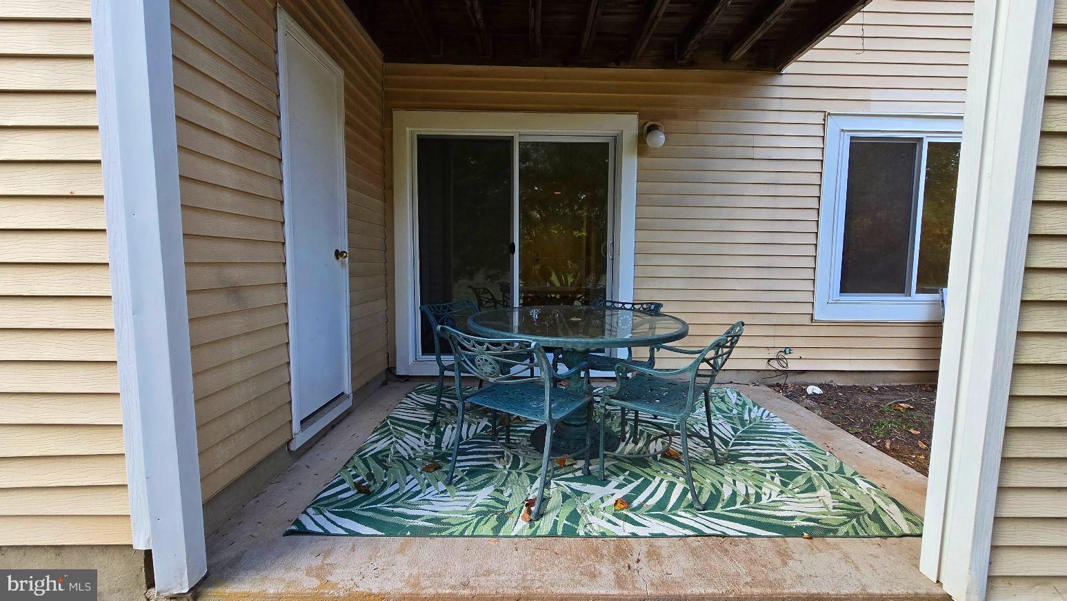 325 Silvia Street Ewing, NJ 08628 - Photo 20 of 21 a chair and table in a balcony