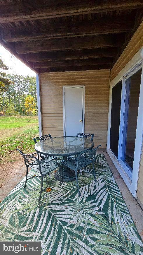 325 Silvia Street Ewing, NJ 08628 - Photo 21 of 21 a backyard of a house with table and chairs