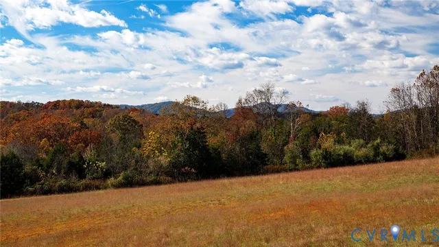 a view of mountain with sunset
