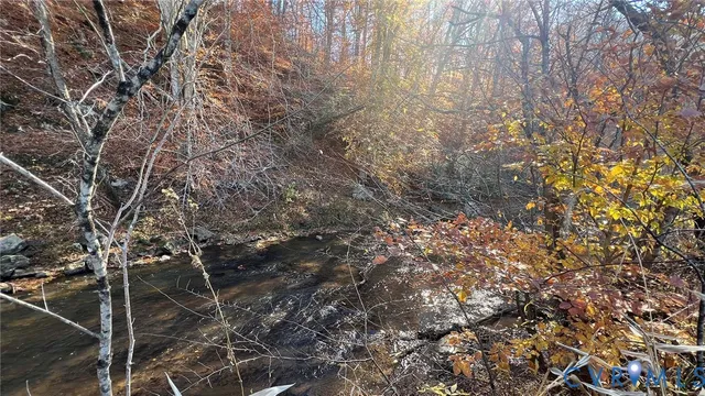 a big house with big yard and large trees