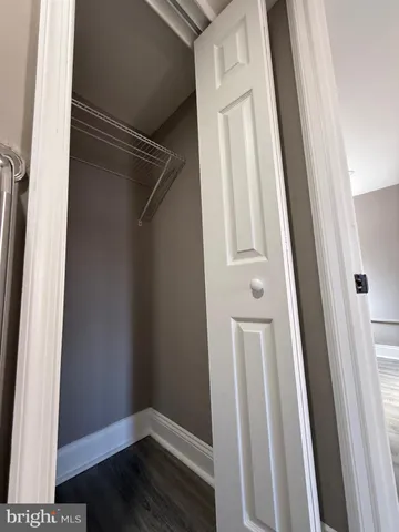 a view of front door with wooden floor