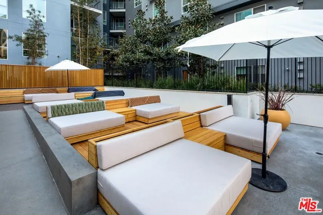 swimming pool with outdoor seating and yard