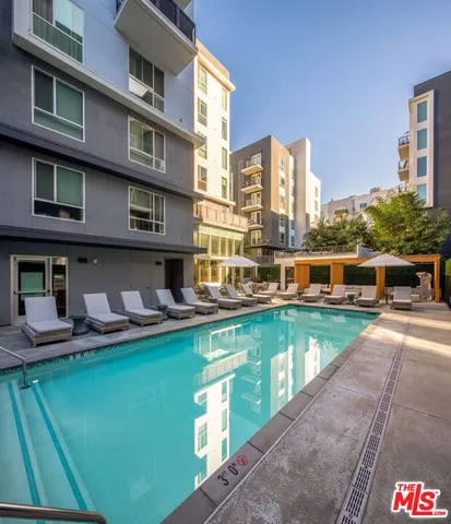 a view of a patio with chairs and a table