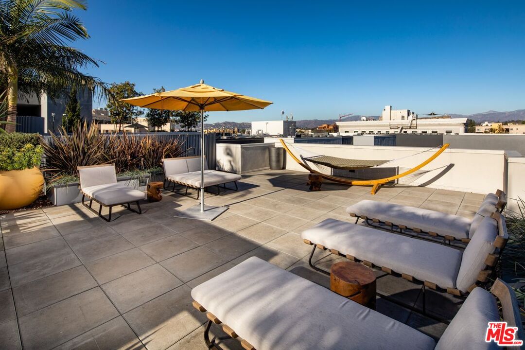 1120 West 6th Street, Unit 2257 Los Angeles, CA 90017 - Photo 34 of 51 a terrace with outdoor seating and city view