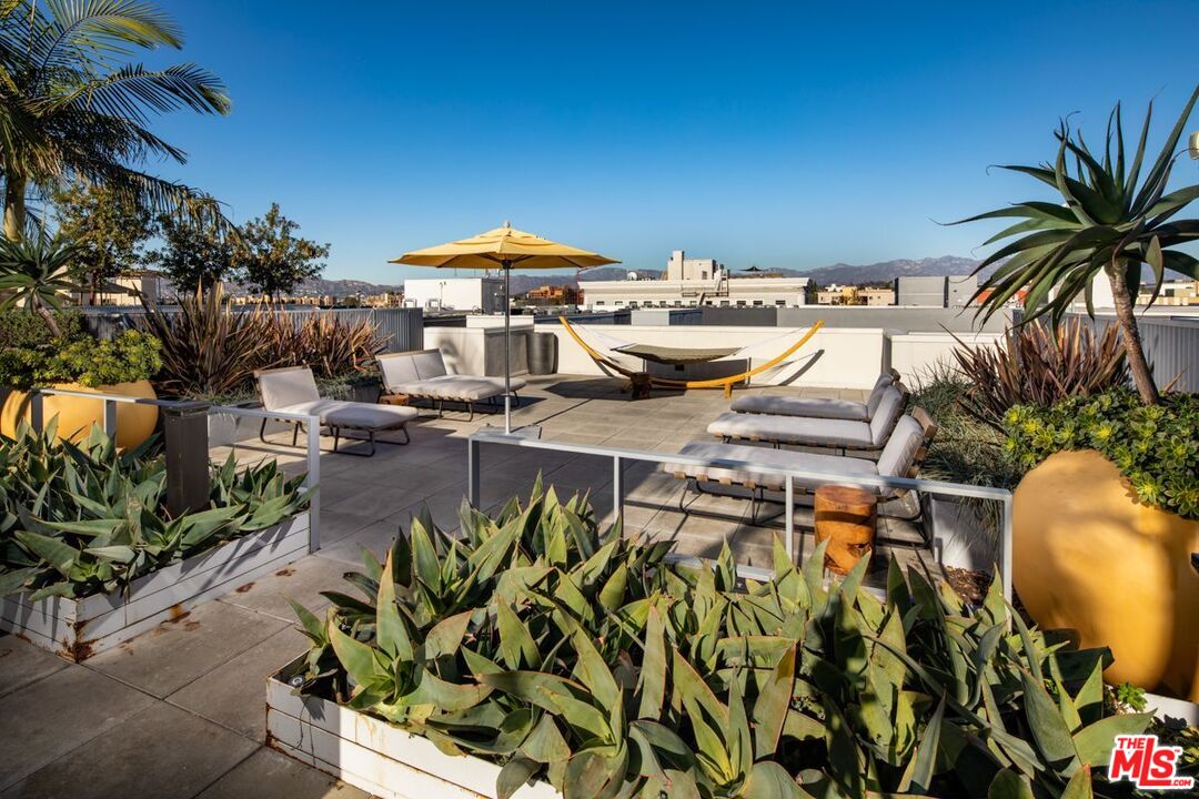 1120 West 6th Street, Unit 2257 Los Angeles, CA 90017 - Photo 35 of 51 an outdoor space with patio area and white umbrellas