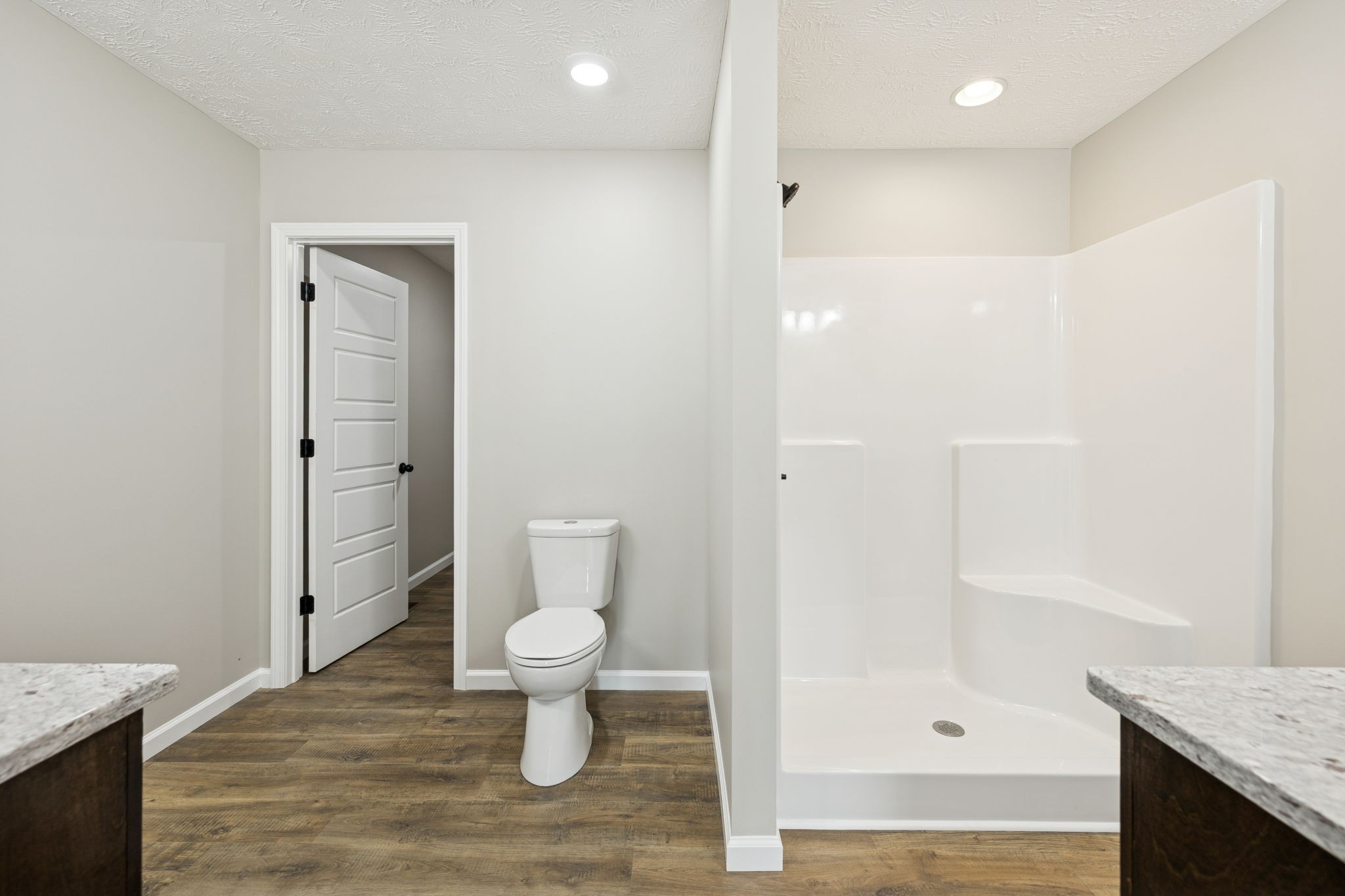 2623 Oak Knob Road Lafayette, TN 37083 - Photo 21 of 36 a bathroom with a granite countertop sink a toilet and shower