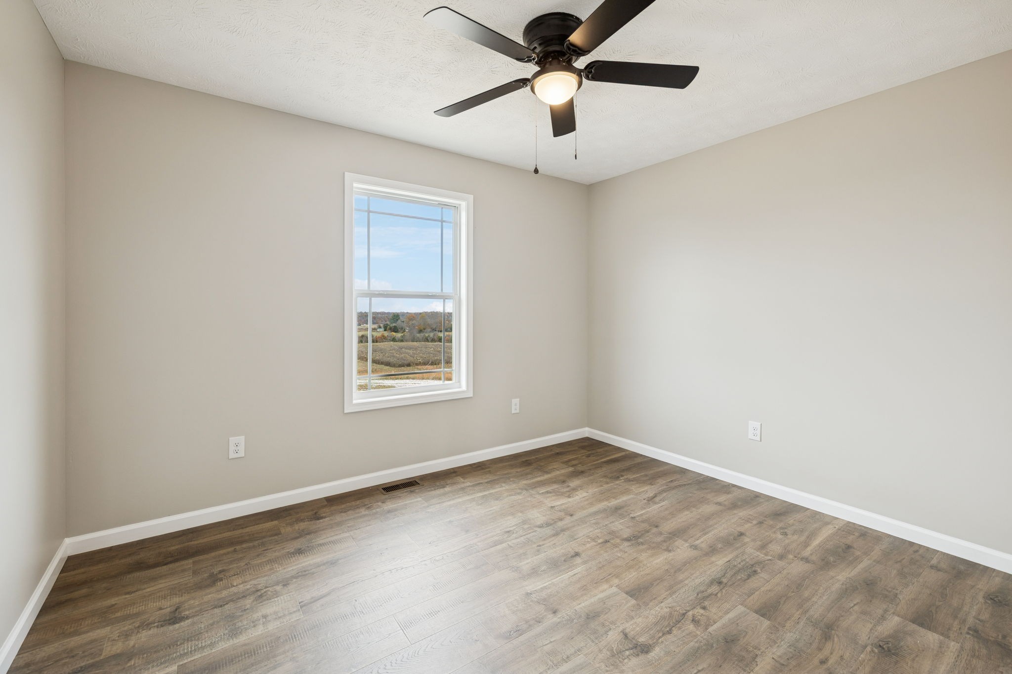2623 Oak Knob Road Lafayette, TN 37083 - Photo 25 of 36 an empty room with a window and a fan