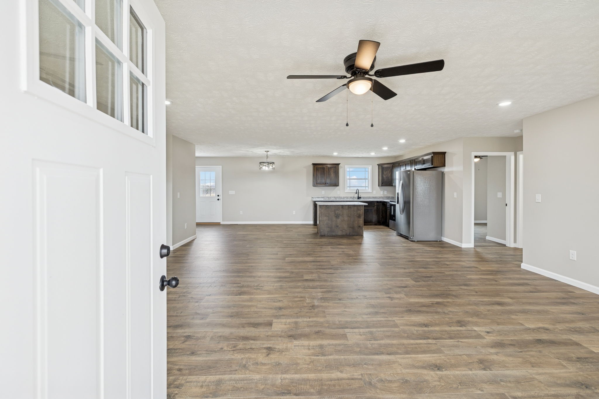 2623 Oak Knob Road Lafayette, TN 37083 - Photo 5 of 36 a view of empty room with wooden floor and ceiling fan