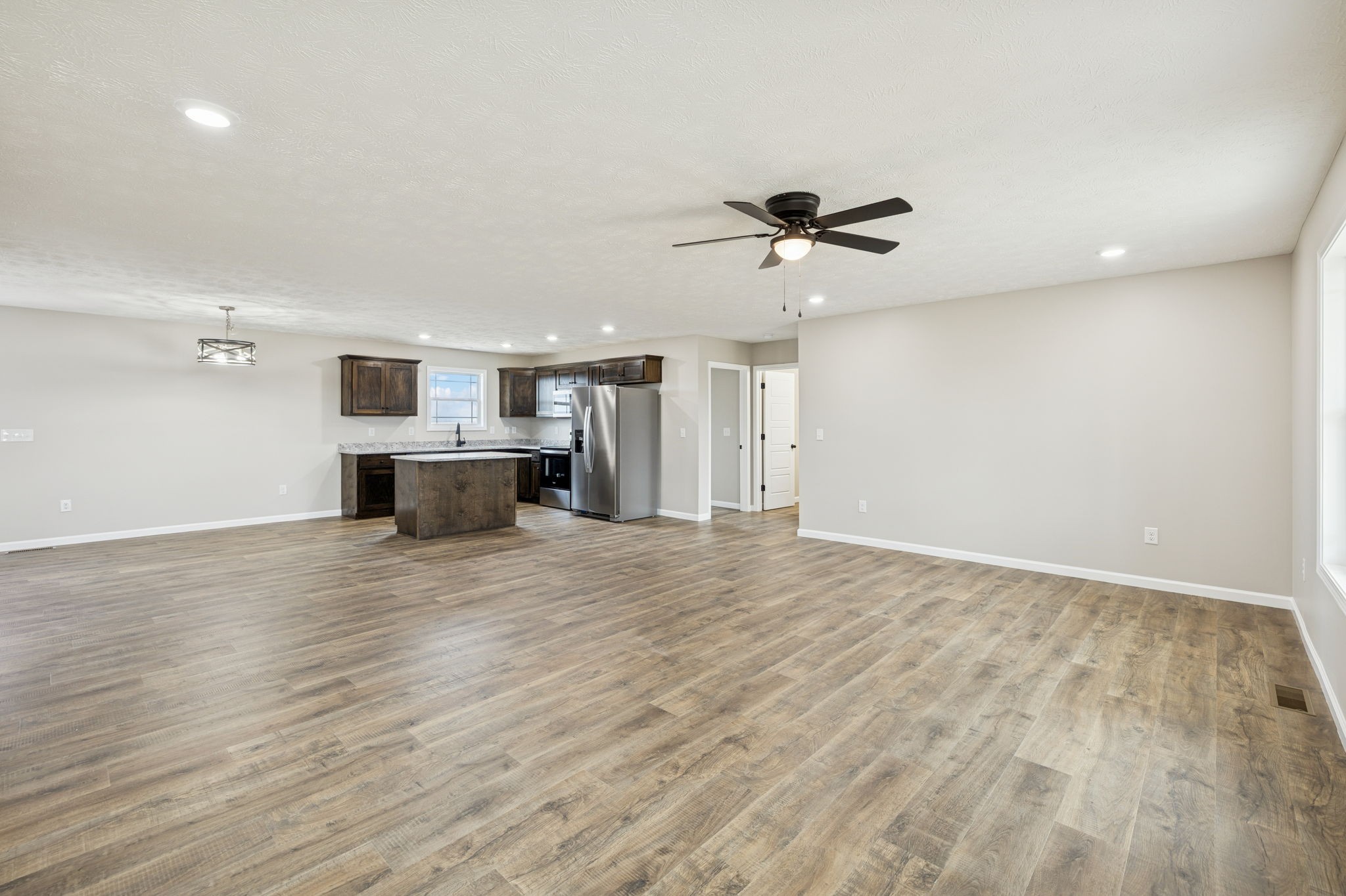 2623 Oak Knob Road Lafayette, TN 37083 - Photo 7 of 36 a view of empty room with wooden floor and fireplace
