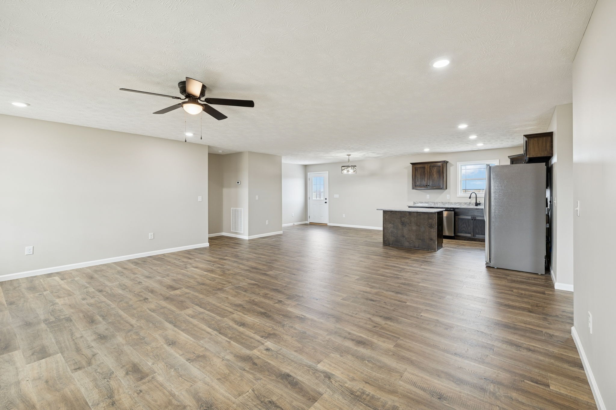 2623 Oak Knob Road Lafayette, TN 37083 - Photo 8 of 36 a view of empty room with wooden floor and windows