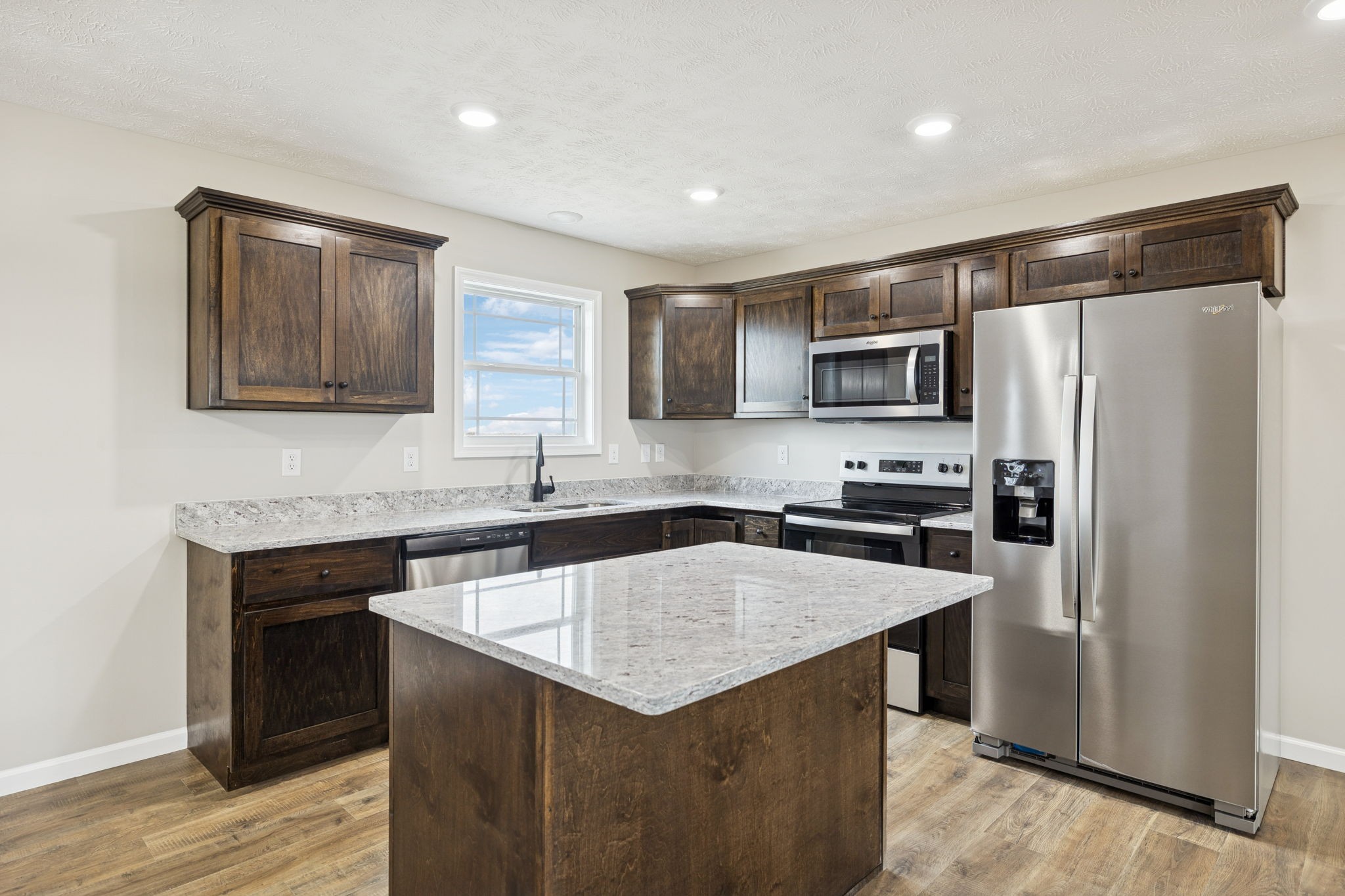 2623 Oak Knob Road Lafayette, TN 37083 - Photo 10 of 36 a kitchen with a stove a refrigerator and a sink