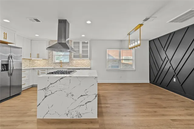 a view of kitchen with sink window and stainless steel appliances