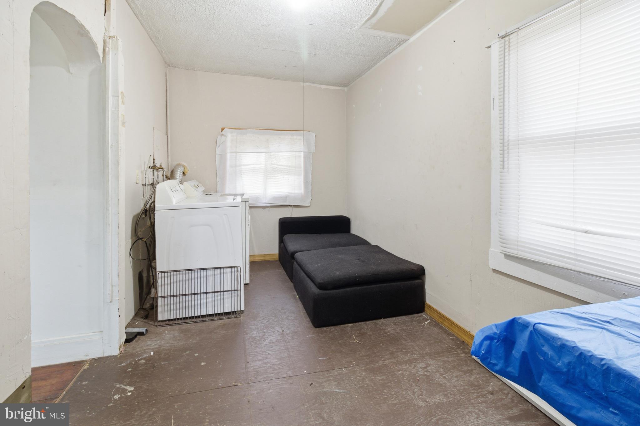 6408 Eastbourne Avenue Baltimore, MD 21224 - Photo 14 of 34 a living room with furniture and a window