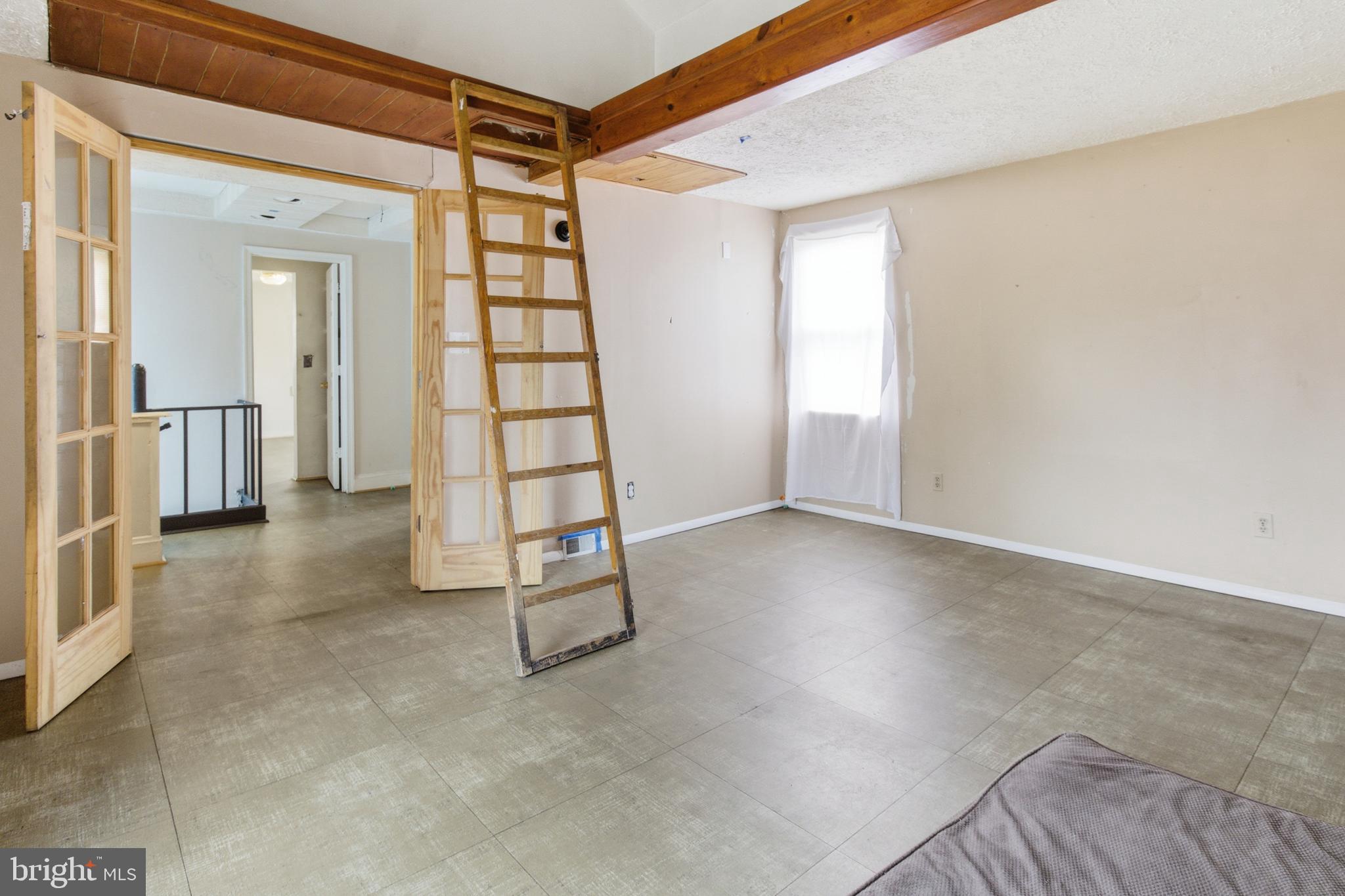 6408 Eastbourne Avenue Baltimore, MD 21224 - Photo 18 of 34 an empty room with windows