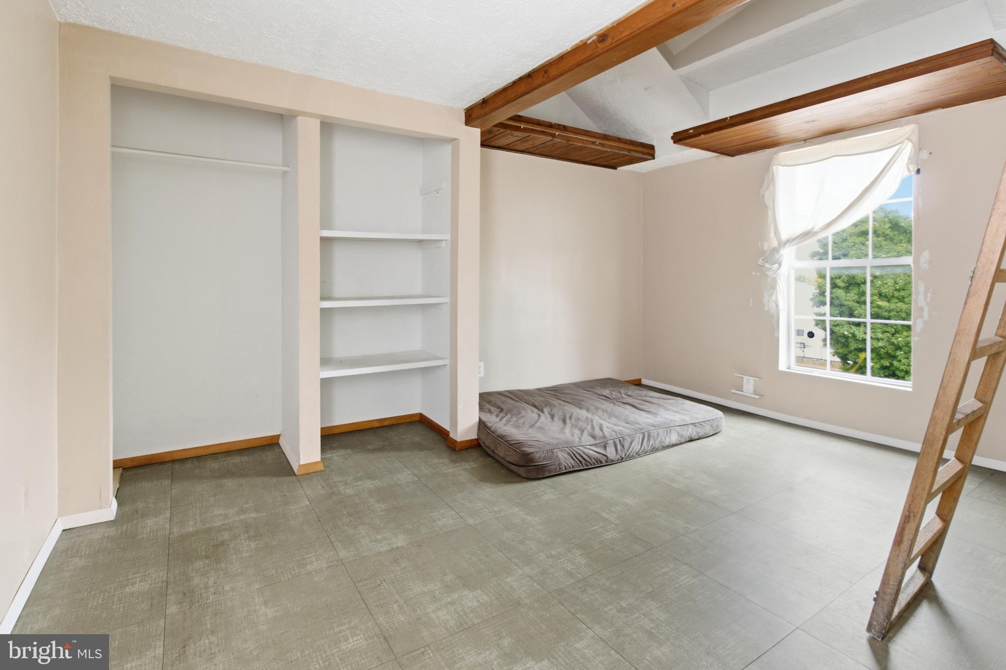 6408 Eastbourne Avenue Baltimore, MD 21224 - Photo 19 of 34 a view of an empty room with a window