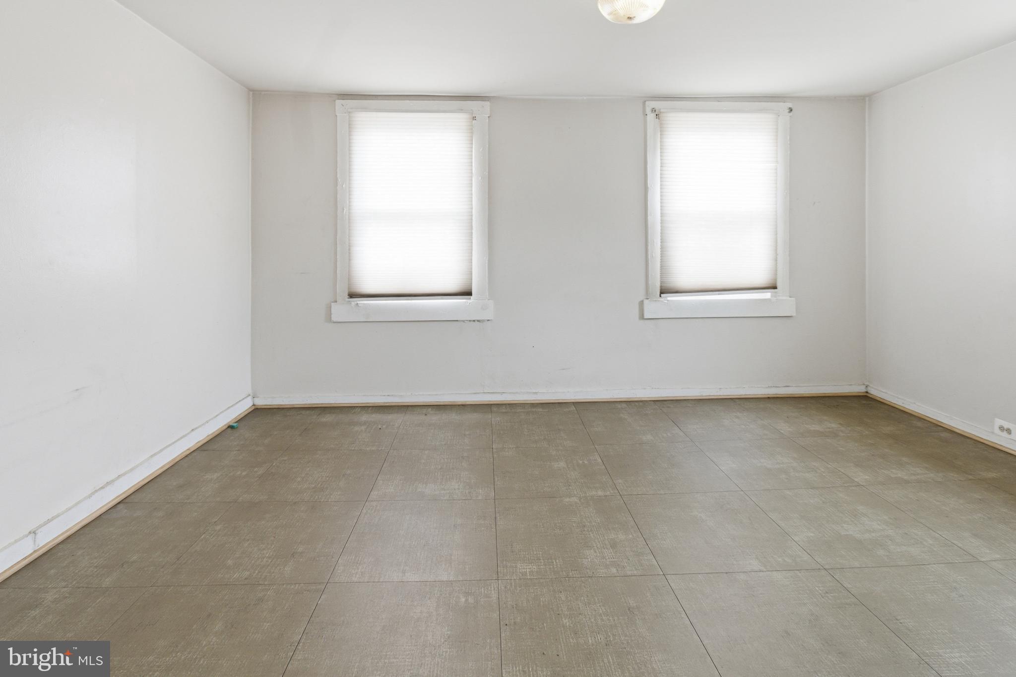 6408 Eastbourne Avenue Baltimore, MD 21224 - Photo 25 of 34 an empty room with windows