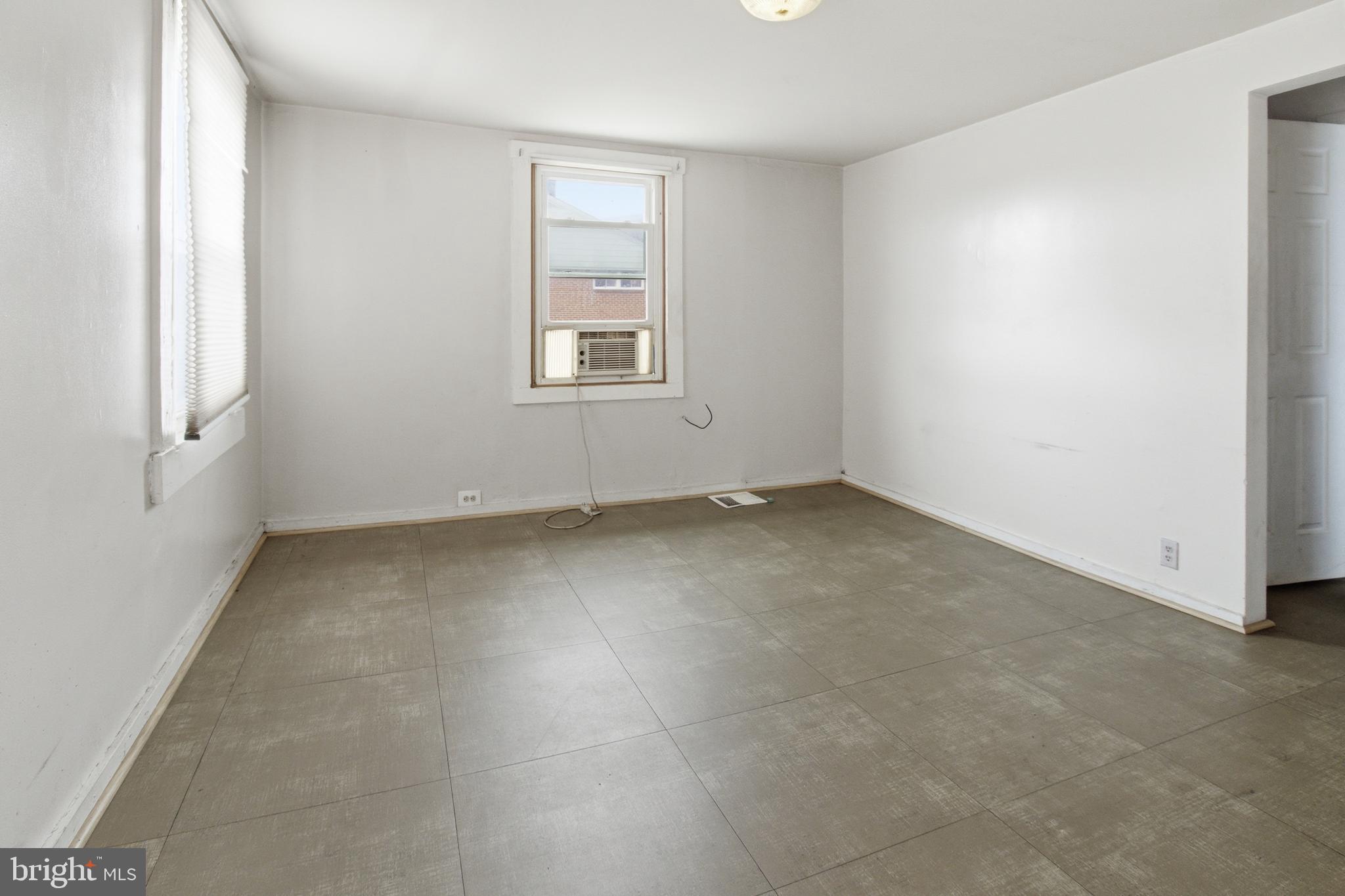 6408 Eastbourne Avenue Baltimore, MD 21224 - Photo 26 of 34 an empty room with windows