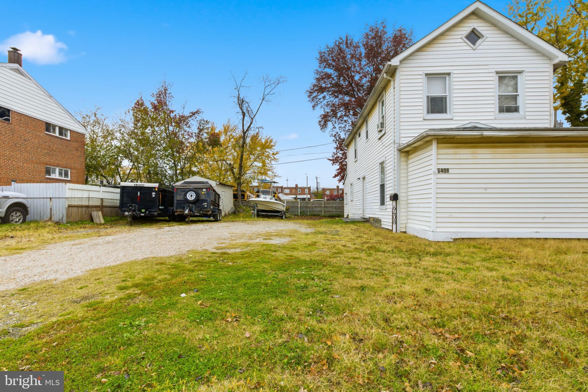 6408 Eastbourne Avenue Baltimore, MD 21224 - Photo 3 of 34 a view of a house with a yard
