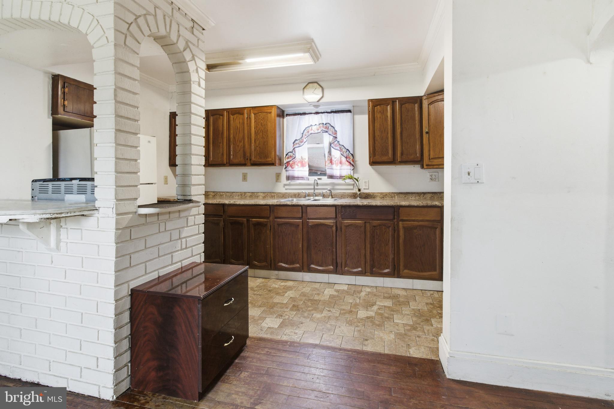 6408 Eastbourne Avenue Baltimore, MD 21224 - Photo 10 of 34 a bathroom with a sink and a mirror