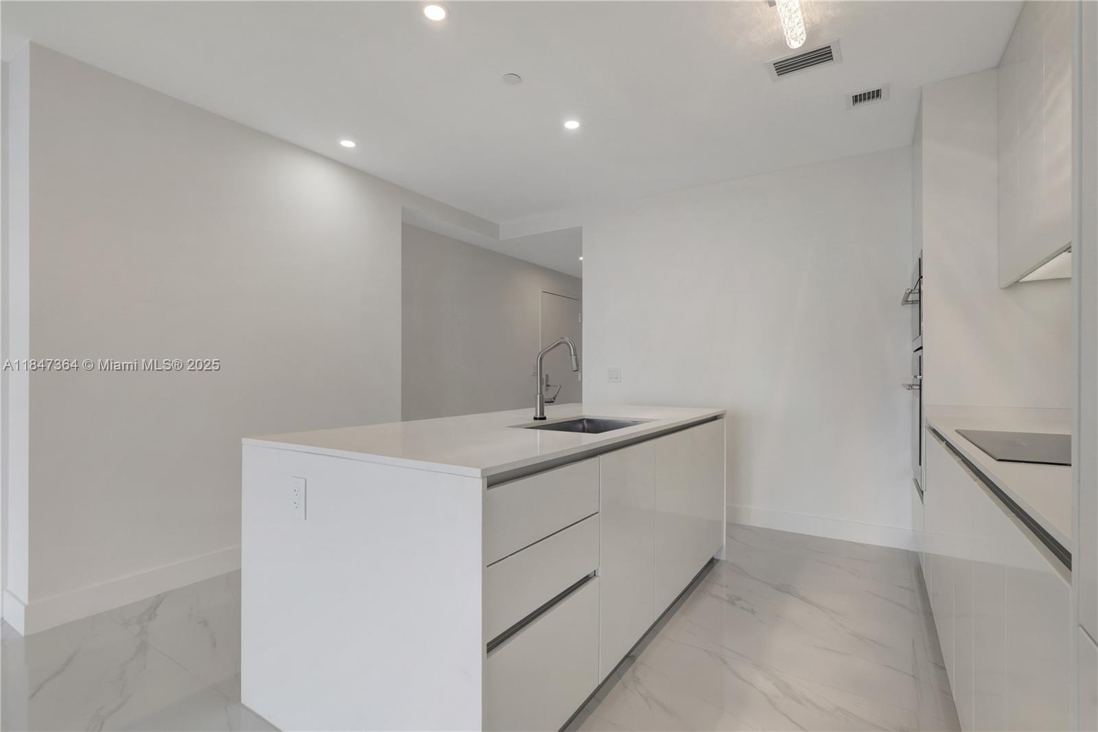700 Northeast 24th Street, Unit 1603 Miami, FL 33137 - Photo 20 of 67 a bathroom with a sink and a mirror