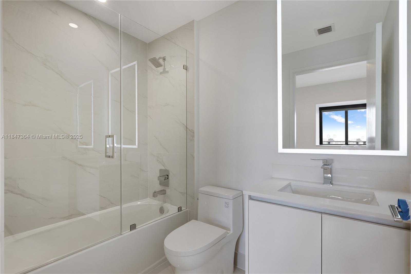 700 Northeast 24th Street, Unit 1603 Miami, FL 33137 - Photo 31 of 67 a bathroom with a sink toilet and shower