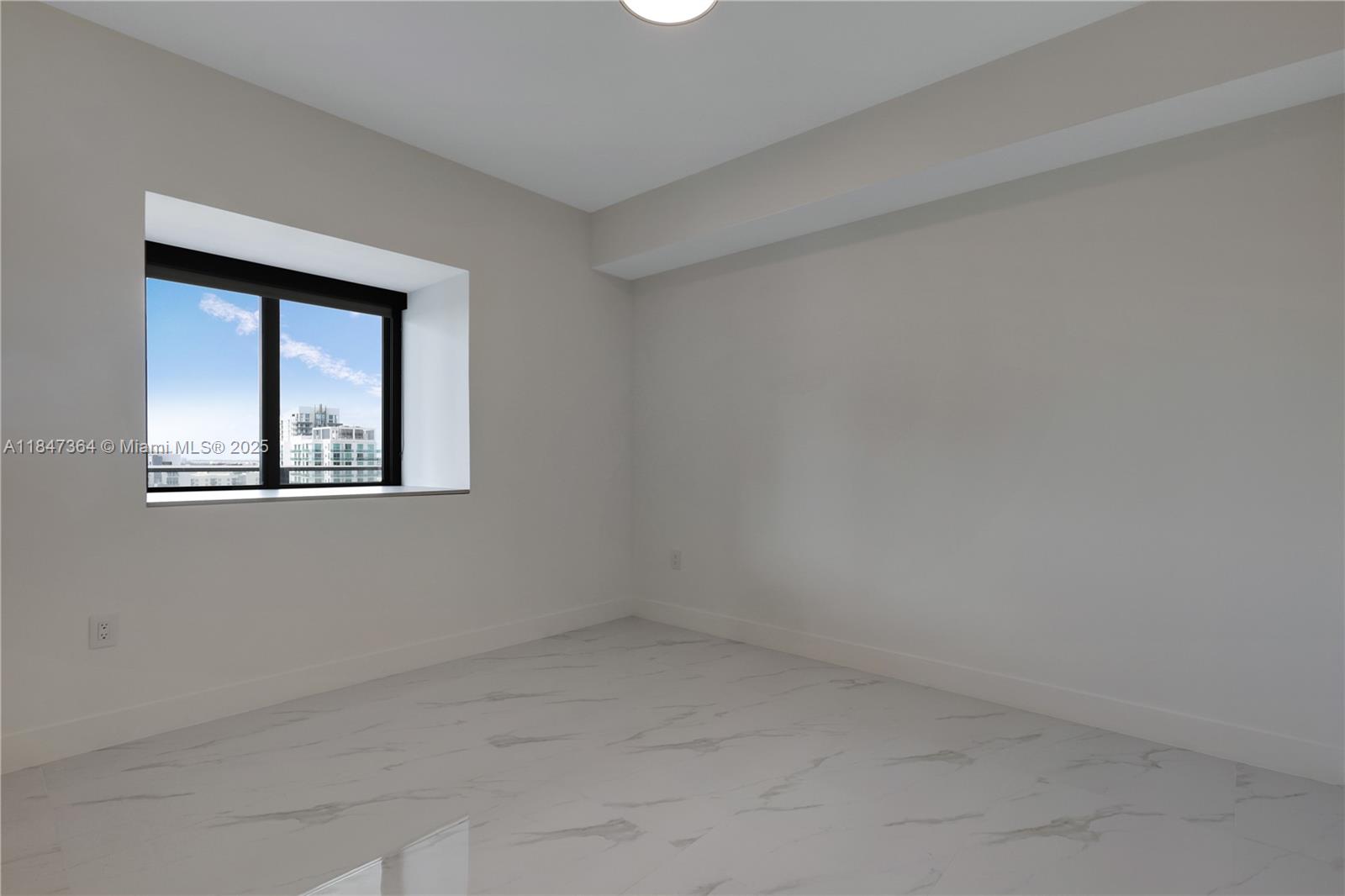 700 Northeast 24th Street, Unit 1603 Miami, FL 33137 - Photo 42 of 67 an empty room with a window