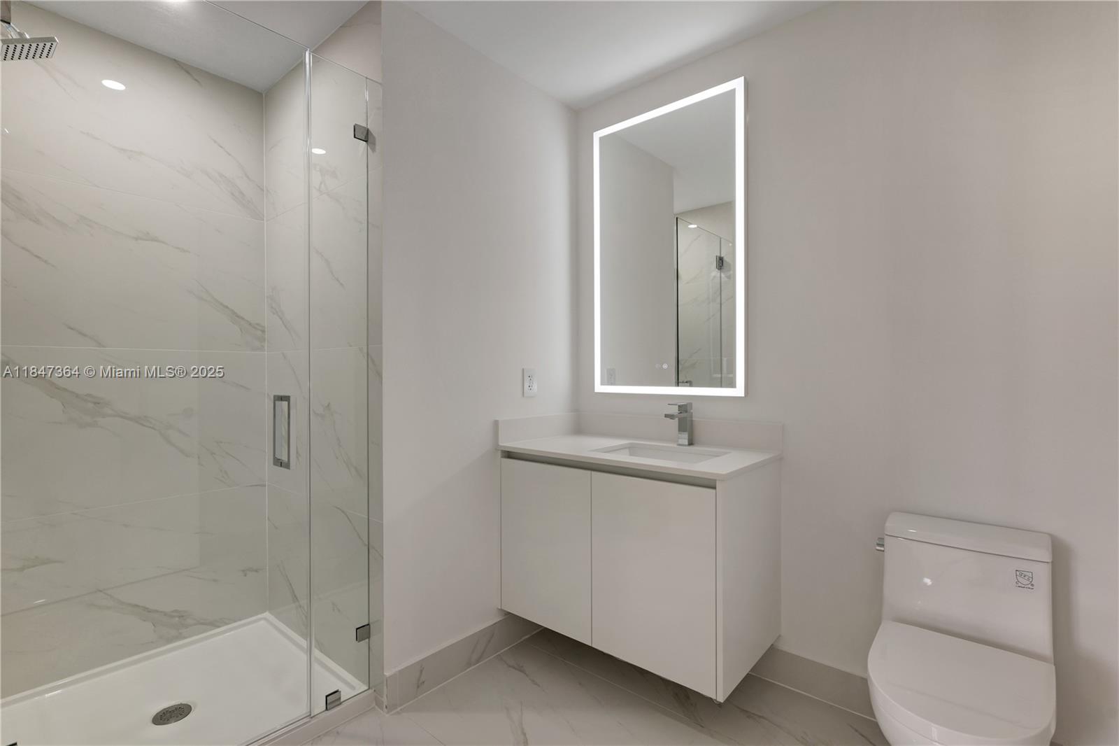 700 Northeast 24th Street, Unit 1603 Miami, FL 33137 - Photo 43 of 67 a bathroom with a toilet sink and shower