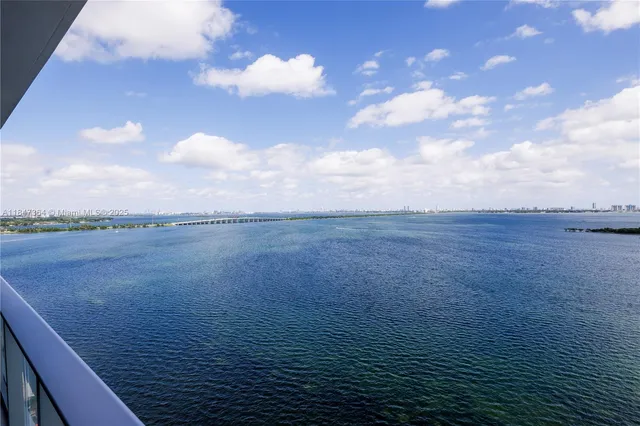 a kitchen with a sink and large window