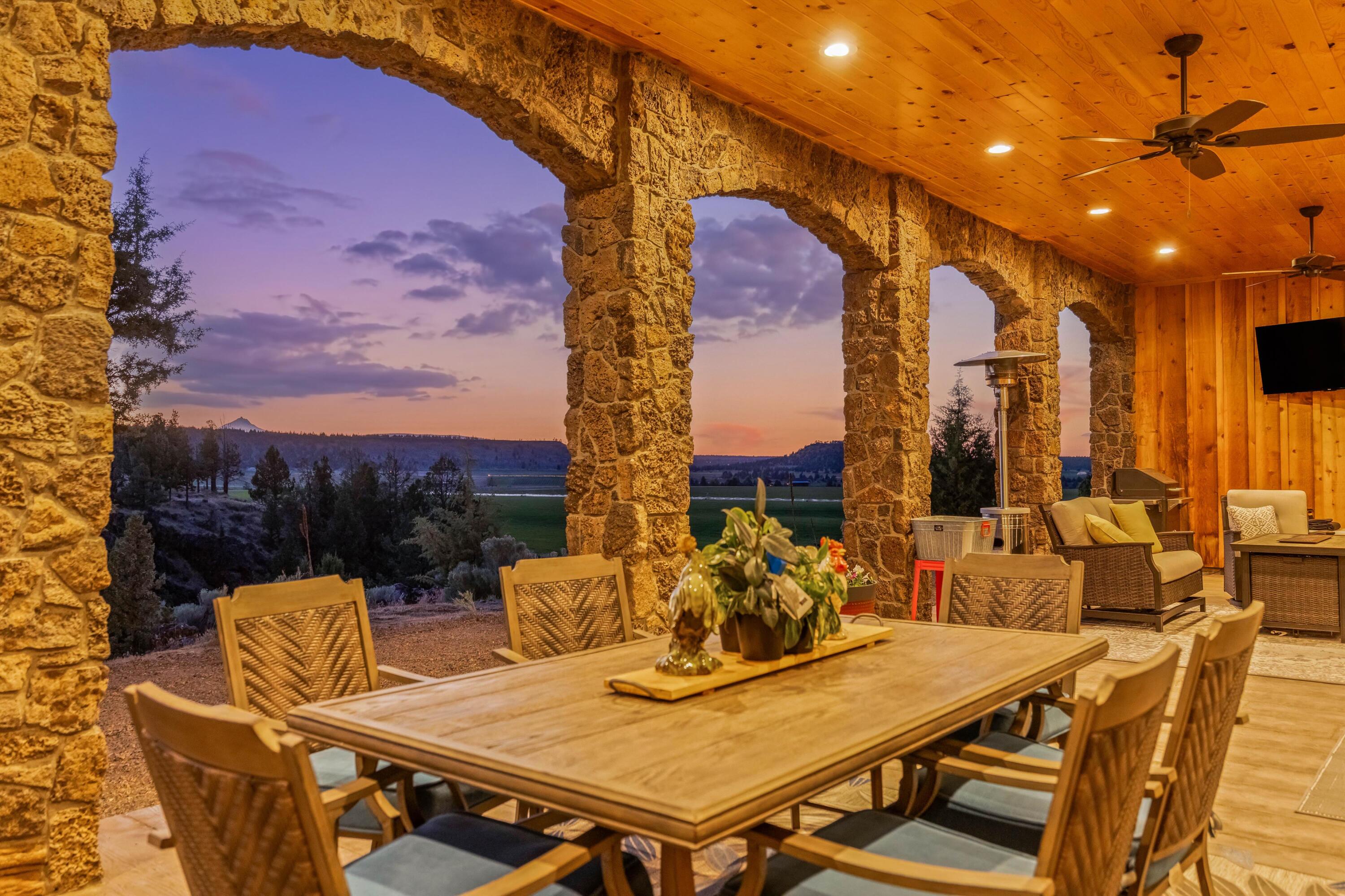 70030 Northwest Hunt Road Sisters, OR 97759 - Photo 13 of 55 a view of a terrace with furniture and a potted plant