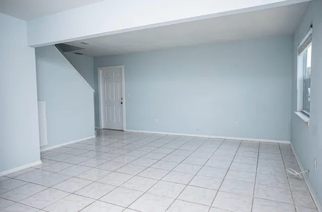 a view of an empty room and window