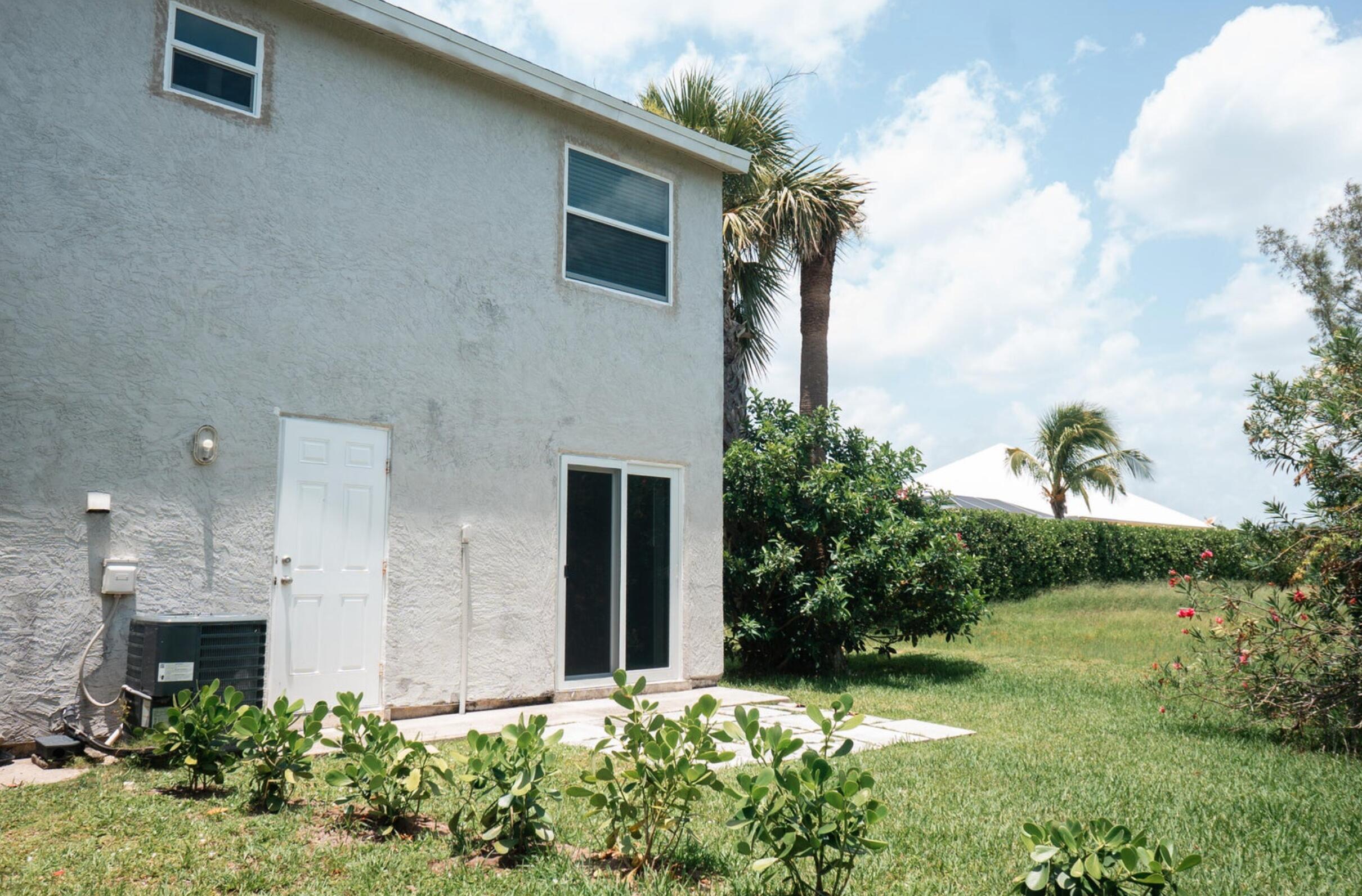 646 Eldorado Street, Unit 2 Fort Pierce, FL 34949 - Photo 10 of 11 a front view of a house with garden