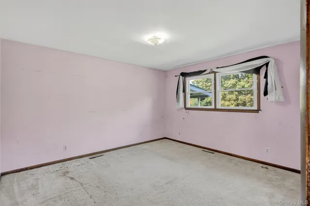 a bathroom with a sink toilet and a mirror