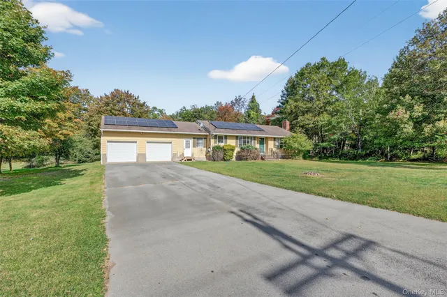 a view of house with outdoor space and yard