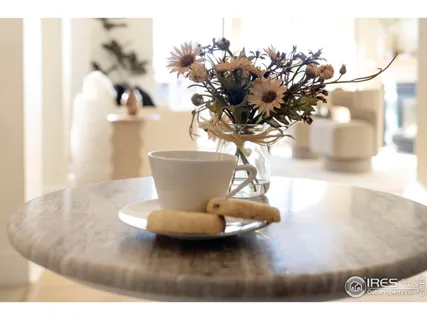 a view of a vase of flowers sitting on a table