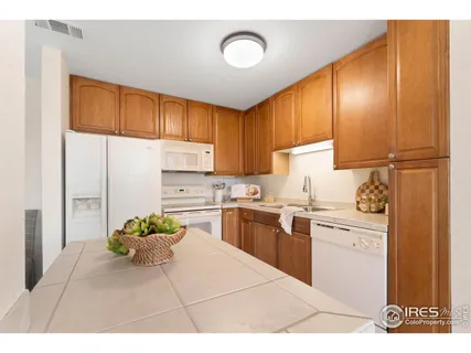 a kitchen with cabinets and appliances