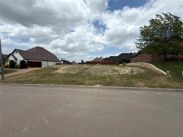 a view of ocean with a big yard