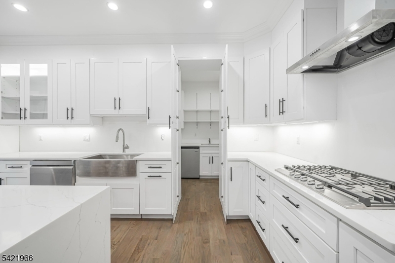 85 Pine Brook Road Montville, NJ 07082 - Photo 16 of 50 a kitchen with stainless steel appliances white cabinets and a stove