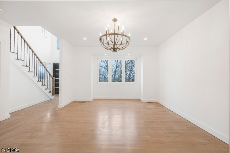 85 Pine Brook Road Montville, NJ 07082 - Photo 20 of 50 a view of an empty room with wooden floor